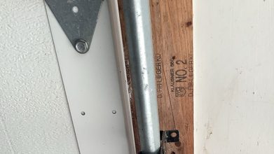 A garage door opener head with its cover removed